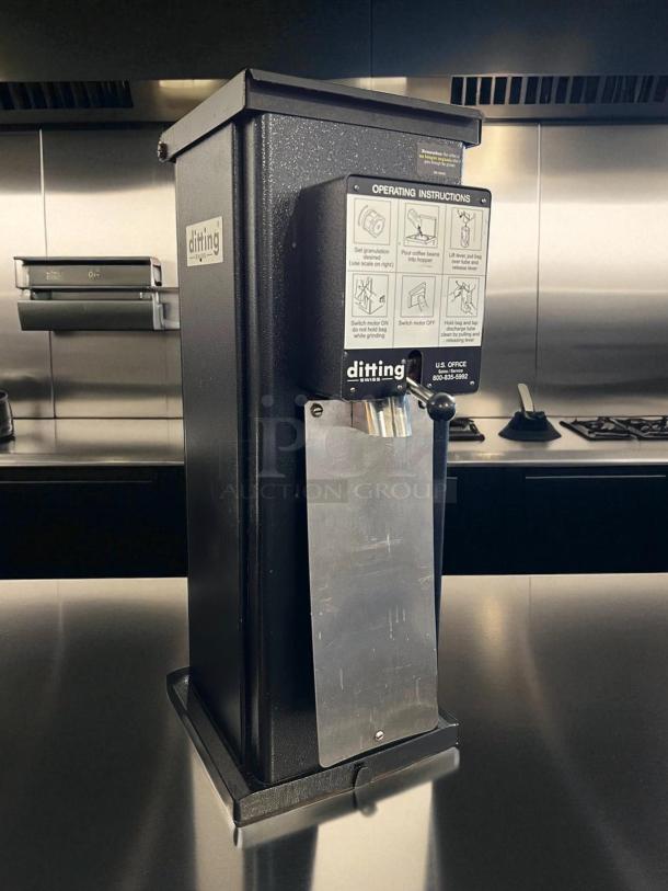 Ditting KR1203 commercial coffee grinder, excellent condition, tested and working, operating instructions visible, sleek design.