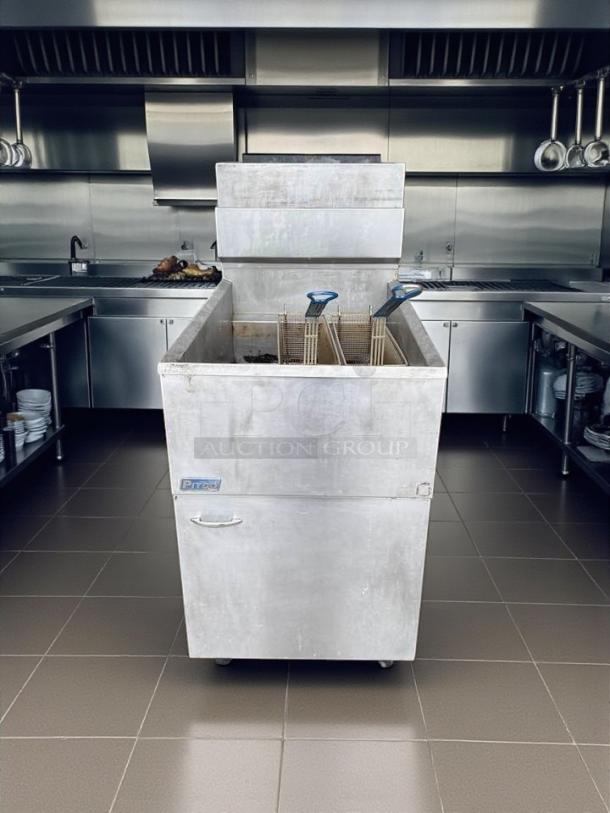 Pitco 65C+S 65 lb natural gas fryer, floor model, excellent condition, fully tested, in stainless steel commercial kitchen.
