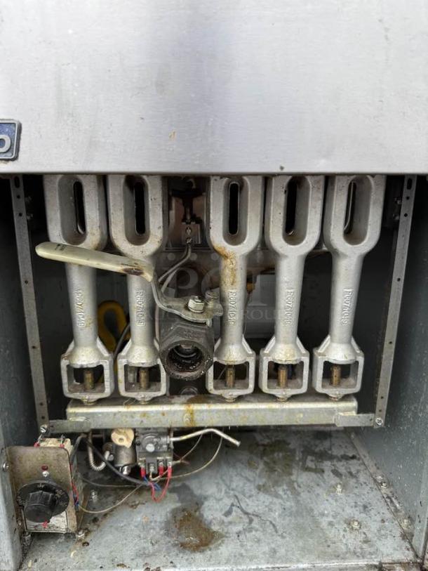 Pitco 65C+S 65 lb natural gas fryer, floor model, shown with burners and wiring, excellent condition, fully tested.