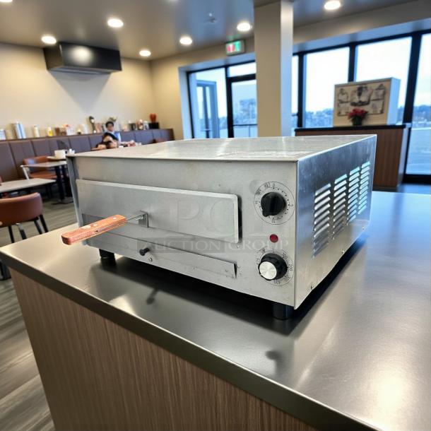 Wisco 560B Deluxe Pizza Oven, 120V, 1700W, stainless steel, wooden handle, temperature dial, tested and working condition.
