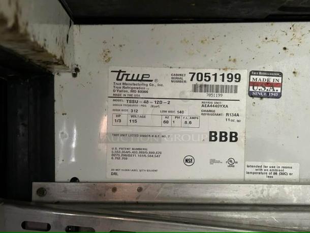Label on True TSSU-48-12D-2 sandwich prep table, 115V, NSF certified, R134A refrigerant, serial number 7051199, Made in USA.