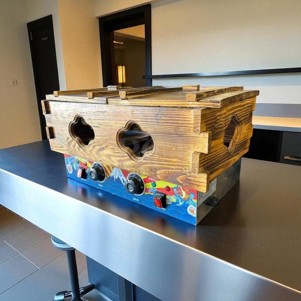 Kanto Kitchen electric oden cooking machine with wooden base. Features decorative front panel, excellent condition, 115v.