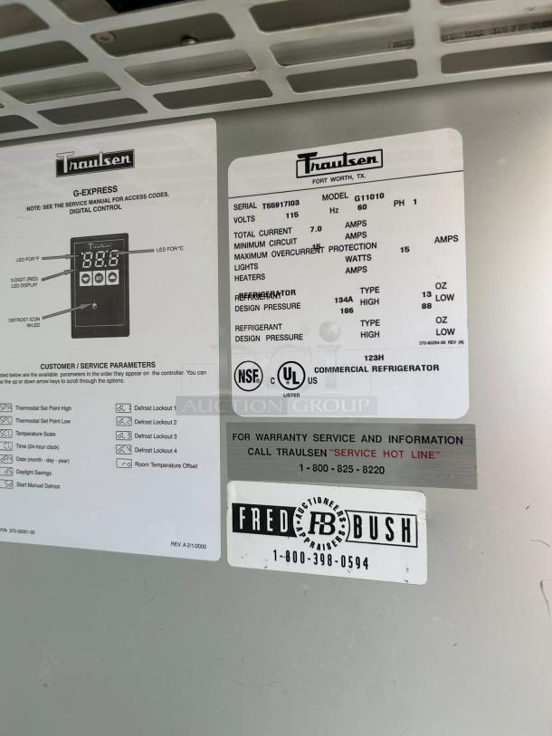 Traulsen G11010 refrigerator label showing model, serial number T65917103, 115v, and service info.
