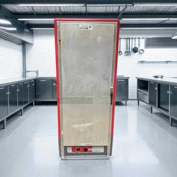 Metro C539-HFS-U heated holding cabinet, red, solid door, tested and working, in a commercial kitchen setting.
