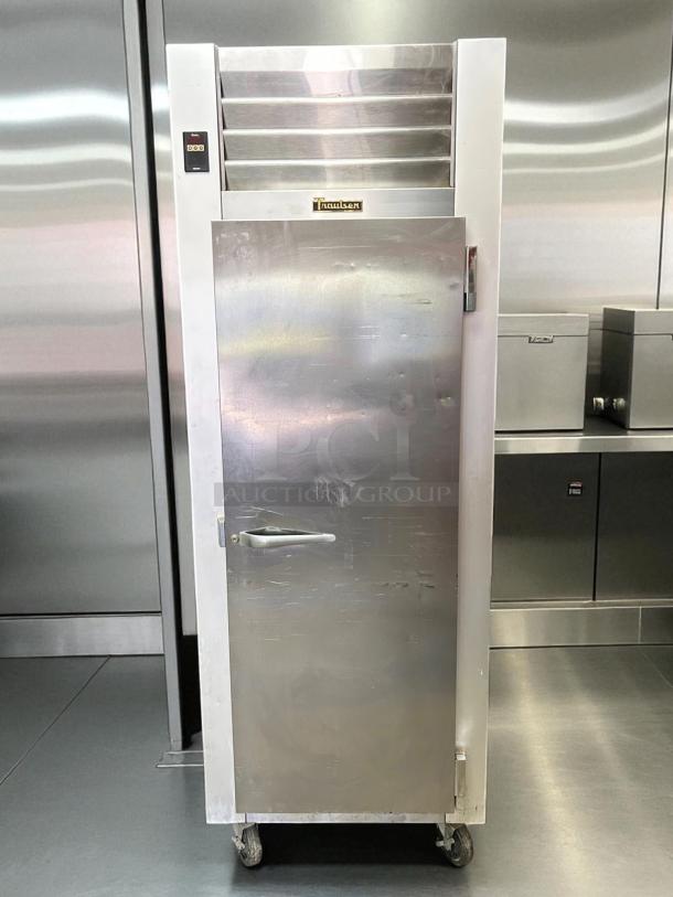 Traulsen Commercial Freezer Model G12010 in excellent condition, fully tested and working, with a stainless steel exterior.
