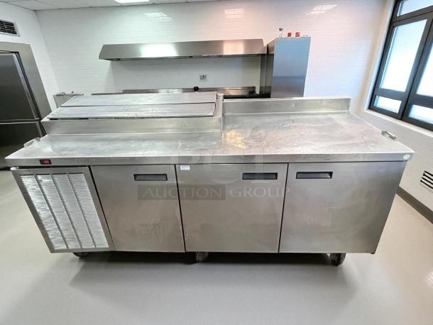 Delfield 3 Door Pizza Prep Table, excellent condition, stainless steel, 115v, tested and working, spacious design.