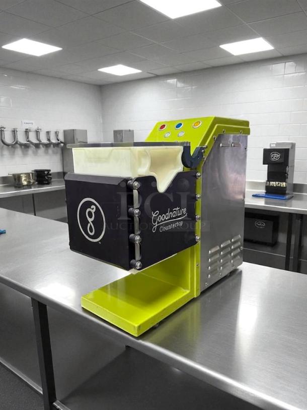 Goodnature Countertop Cold Press Juicer CT7, excellent condition, 115V, fully tested, black and lime green finish, visible brand logo.