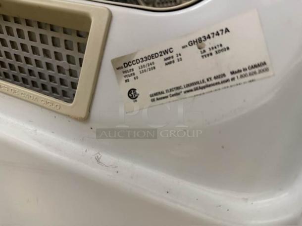 GE gas coin-operated dryer DCCD330GD2WC, excellent condition, tested and working, model and specs label visible.