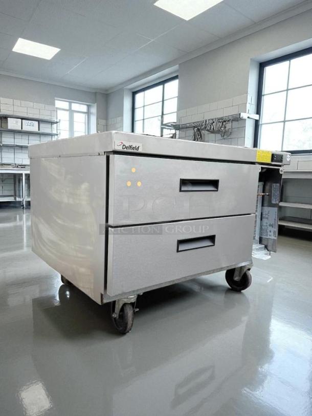 Delfield 2-drawer refrigerated chef base, excellent condition, tested and working, stainless steel finish, on casters.