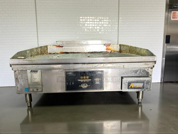 AccuTemp GGF1201A3650-T1 36" gas griddle in excellent condition, showing thermostatic controls and AccuTemp branding.