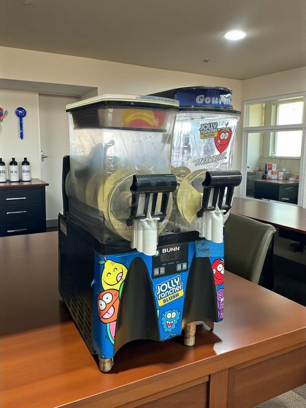 Bunn Ultra-2 frozen drink machine in excellent condition, 120V, featuring dual mixing tanks and Jolly Rancher branding.