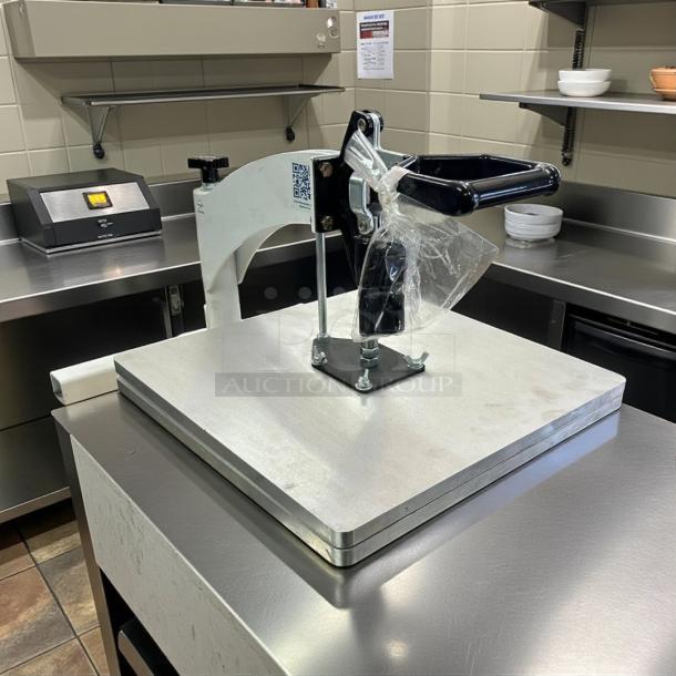 DoughXpress manual pizza dough press in excellent condition on stainless steel counter. Fully tested and working.
