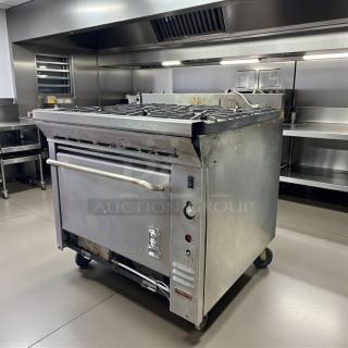 Montague 6-burner gas range with oven, excellent condition, natural gas, fully tested and working, stainless steel finish.