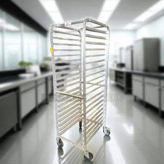 Like new bakery speed rack with multiple shelves, bright metal finish, and caster wheels for easy mobility, in excellent condition.