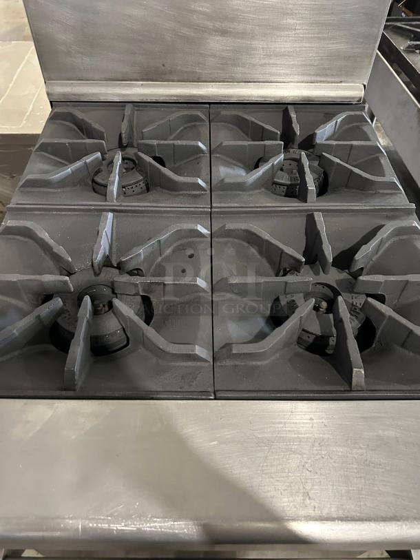American Range AR-4 24" 4-burner natural gas range in excellent condition, with space-saver oven, 155,000 BTU.
