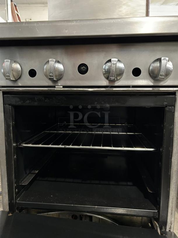 American Range AR-4 24" natural gas 4-burner range and oven, 155,000 BTU, in excellent condition, tested & working.