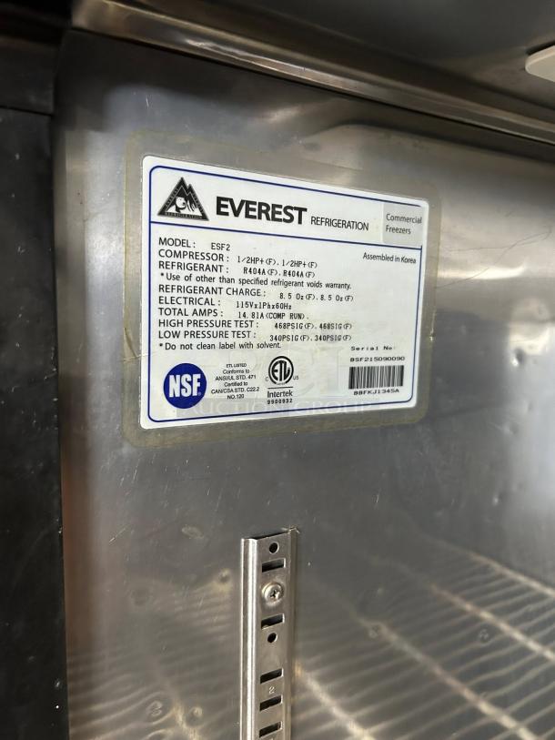 Everest ESF2 stainless steel reach-in freezer label showing model specifications and NSF certification.