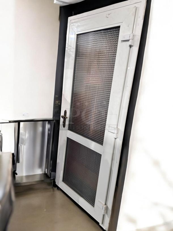 White metal frame door, 36"x83", with dual textured glass panels, great condition, tested and working.