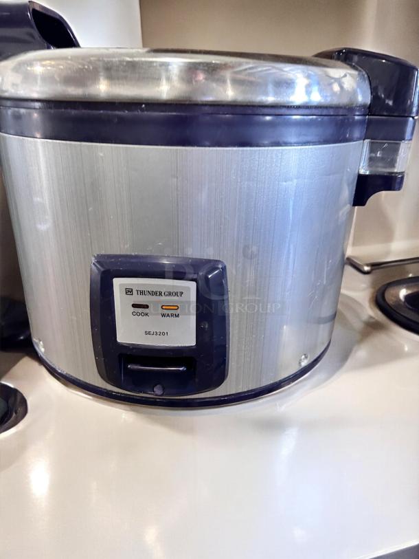 Thunder Group SEJ3201 commercial rice cooker, excellent condition, 30-cup capacity. Silver finish with "Cook" and "Warm" indicators.