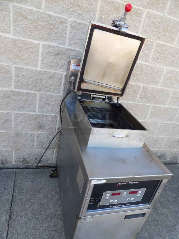 Henny Penny 1000 Computron stainless steel pressure fryer, excellent condition, includes metal basket, on casters, 208V, 3-phase.