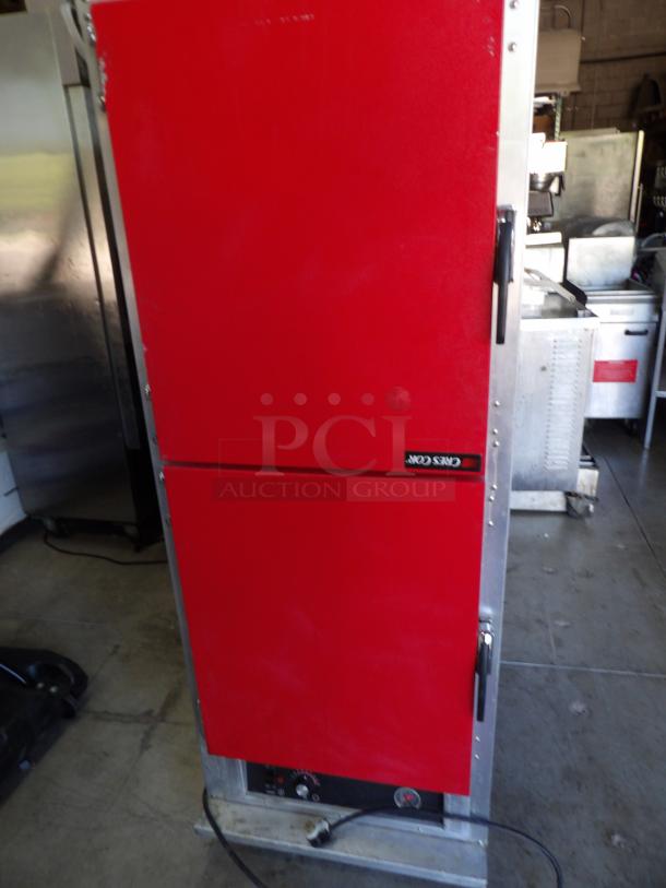CresCor H-135-UA-11R metal heated cabinet, red doors, on commercial casters. Powers on, 120 volts, excellent condition.