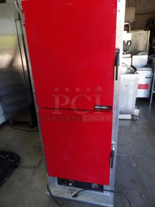 CresCor H-135-UA-11R metal heated cabinet, red doors, on commercial casters. Powers on, 120 volts, excellent condition.