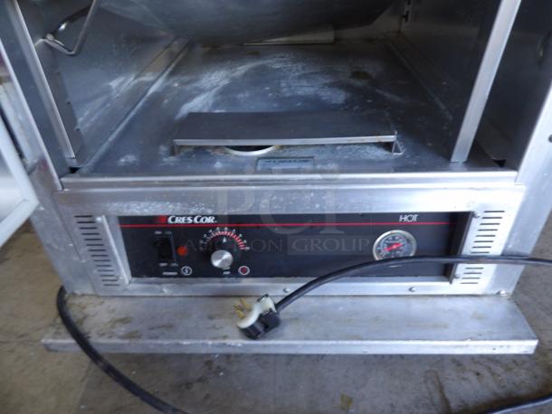 CresCor H-135-UA-11R heated cabinet on casters, powers on and heats, 120V, visible control panel and power cord.