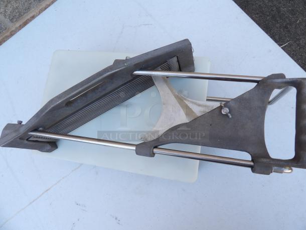 Commercial heavy-duty countertop vegetable slicer with easy slice board, metal frame on legs, excellent condition.