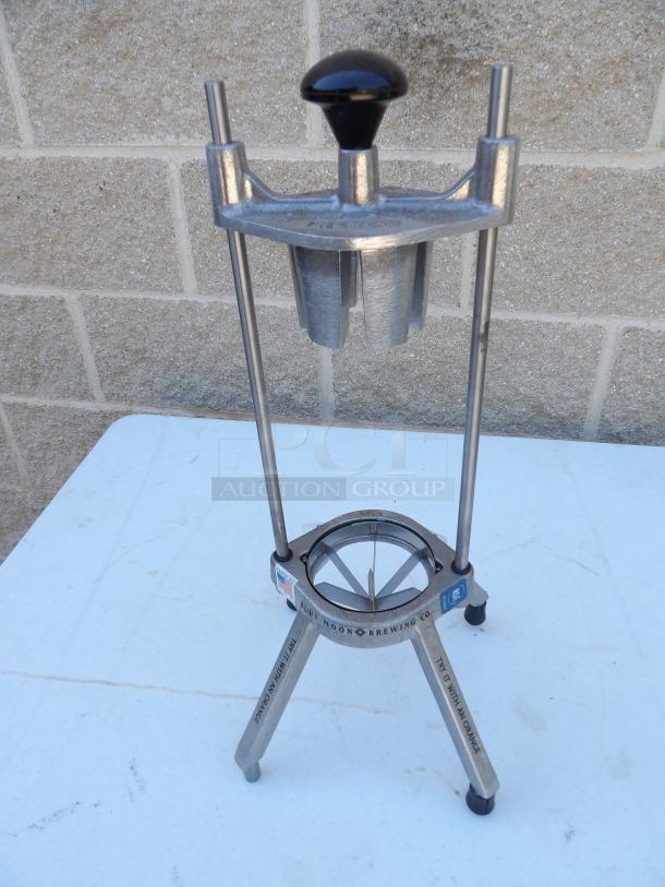 Nemco 4-section fruit/vegetable wedge cutter in good condition, featuring a sturdy metal frame and ergonomic handle.