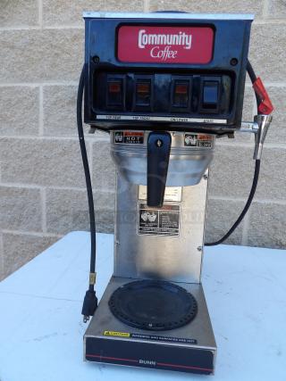 Bunn O-Matic ST-15 commercial coffee brewer, stainless steel, electric, with 2 upper warmers, visible switches, and plug.
