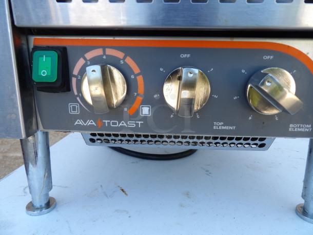 AVA Toast TT-300-240 commercial toaster, stainless steel, on legs, 240V, control knobs for element settings visible.