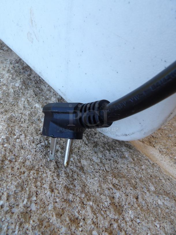 AVA TT-300-240 conveyor toaster plug on textured surface, showing standard 240V plug configuration.