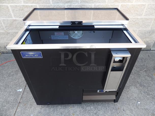 New 2023 Arctic Air AUB36R 37" black horizontal bottle cooler, stainless steel top, excellent condition, brand label visible.