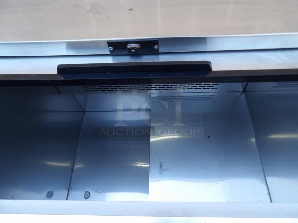 New 2023 Arctic Air AUB36R 37" black horizontal bottle cooler, model AUB36RZ, in pristine condition, stainless steel interior.