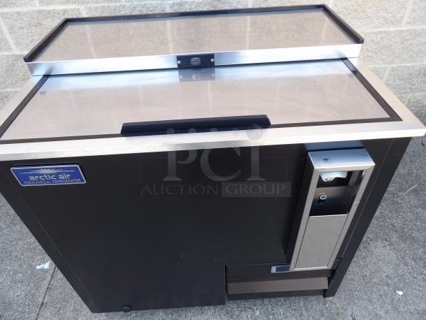 New 2023 Arctic Air AUB36R 37" black horizontal bottle cooler, stainless steel top, branded label, sleek commercial design.