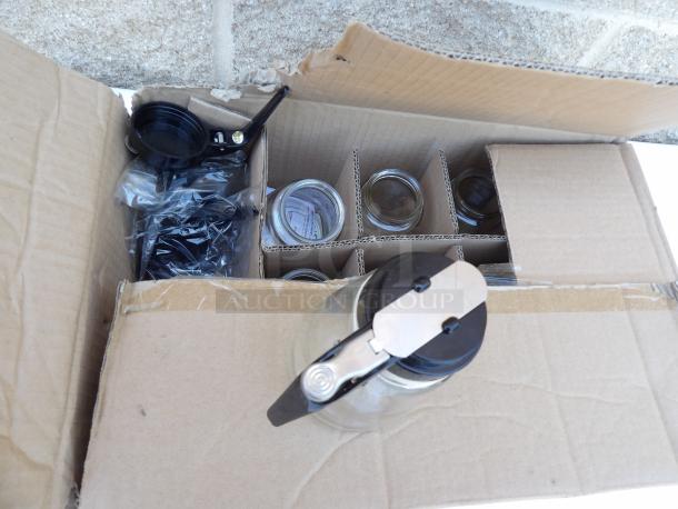 Box of modern 12oz glass syrup dispensers with metal spouts. Includes lids and components, new condition.