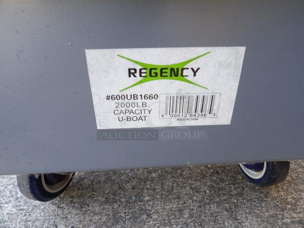 Regency 16" x 63" heavy-duty U-Boat utility cart with center brakes, 2000 lb. capacity, shown with label indicating model #600UB1660.