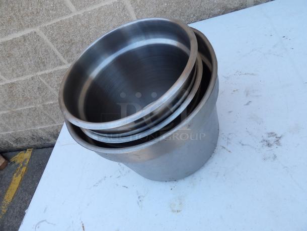 Stainless steel steam pots, 9-inch round, 8-inch deep, stacked, slightly worn, ideal for cooking.