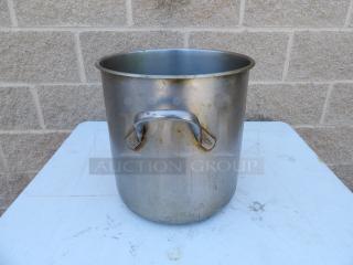 24 Qt. standard weight aluminum stock pot with handles, showing signs of use and patina, sturdy and functional.