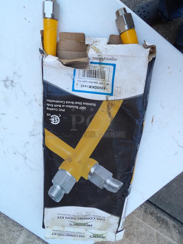 Regency 48" stainless steel gas connector hose, 3/4" diameter, yellow coating, in damaged packaging. Ideal for foodservice.
