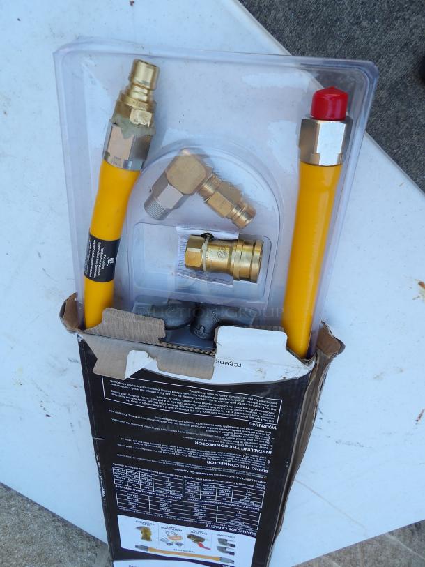 Regency 48" yellow steel gas connector hose, with fittings and kit, 3/4" NPT, new condition, in original packaging.