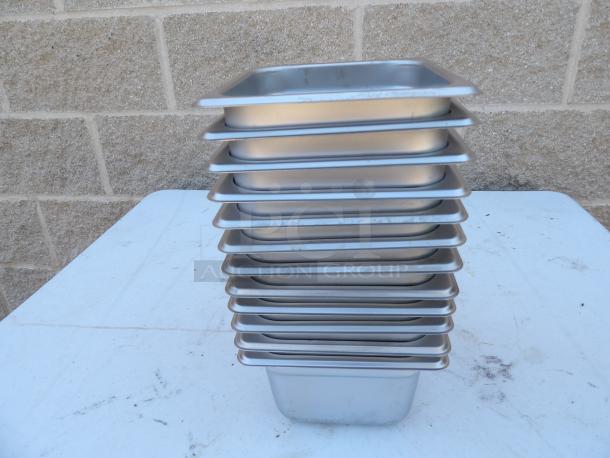 Stainless steel steamer pans, 6x6.5x3.5 inches, set of 6, stacked. Clean and in good condition.