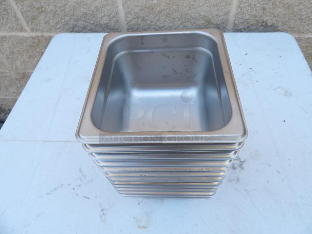 Stainless steel steamer pans, stack of 6, each 6x6.5x3.5 inches. Slightly used condition, ideal for commercial kitchens.