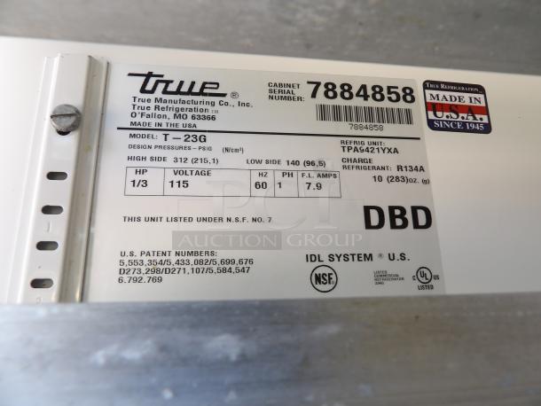 True T-23G cooler label showing model details, serial number 7884858, 115V, 1 phase, refrigerant R134A, and NSF certification.