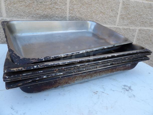 6 used full-size 2 1/2" deep 24-gauge stainless steel steam table pans, anti-jam, with worn edges and visible use.