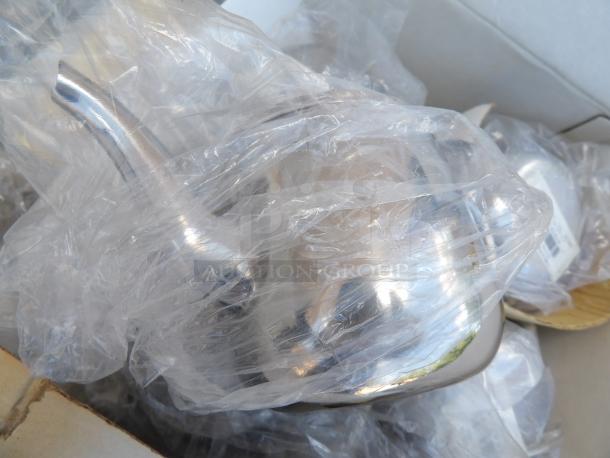 10 oz. stainless steel gooseneck teapot, sealed in plastic. Ideal for precise pouring. New condition.