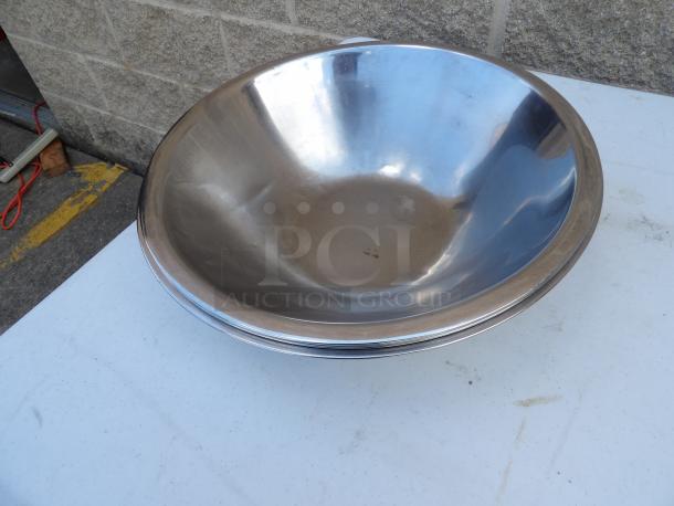 8 Qt. heavy weight stainless steel mixing bowl, 14-inch round, 4.5-inch deep, excellent condition, minor surface marks.