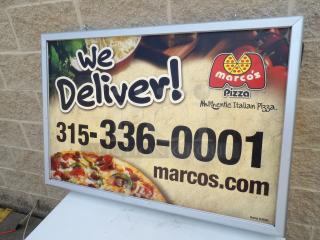 Two-sided lighted sign cabinet with a removable frame, displaying a business advertisement for pizza delivery. Powers on and works great.