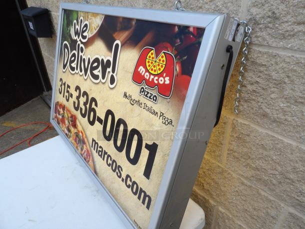 Two-sided lighted sign cabinet; removable frame, powered on, displaying Marco's Pizza ad. Ideal for custom business use.