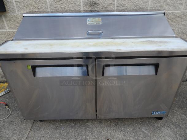 Turbo Air MST-60 prep refrigerator, stainless steel, two solid doors, poly coated wire racks, on casters, 110-120V, 1 phase.
